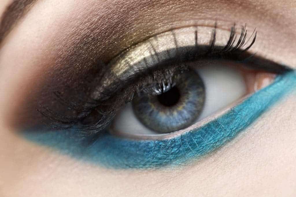 Beautiful eye with blue and yellow eye makeup